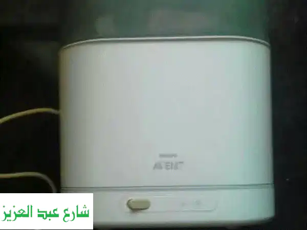 فرصة ذهبية! جهاز تعقيم ببرونات Avent كبير (6 زجاجات) - مستعمل كالجديد لتوفيرك وراحة بالك.