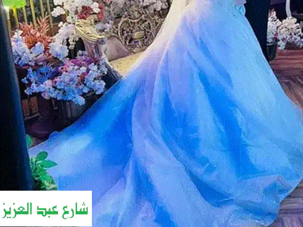 فستان خطوبة هاندميد بيج: تألقي بتصميم صافي العطار الفريد | أناقة لا تُنسى