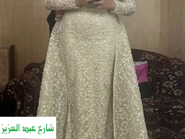 فستان خطوبة هاندميد بيج: تألقي بتصميم صافي...