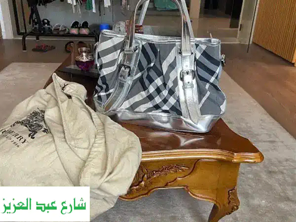 تألقي بـ حقيبة يد بربري جديدة فاخرة | جلد طبيعي 100%...