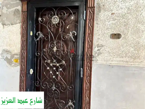 باب شقه خشب زان + باب حديد ٢ طبلة