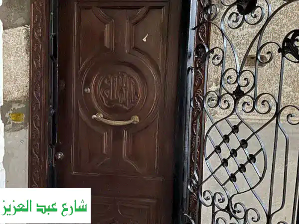 باب شقه خشب زان + باب حديد ٢ طبلة