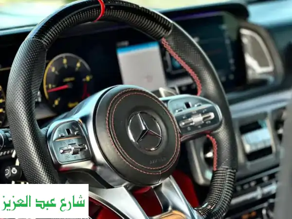 اختبر الفخامة المطلقة: استأجر G63 الأيقونية مع سائق خاص! توصيل حصري للمطار وتجربة استثنائية.