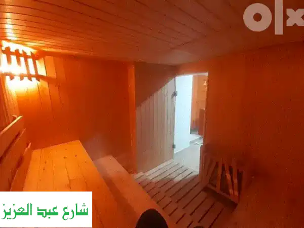 استمتع بالرفاهية: ساونا خشبية، جاكوزي، وحمام...