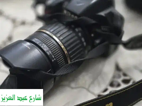 كاميرا نيكون d3200 +عدسة 18200 مع كامل مشتمالتها