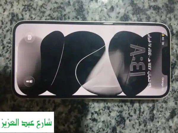 فرصة ذهبية: iPhone 13 أبيض 128GB | بطارية 100% | كسر زيرو بضمان الأصالة والمشتملات كاملة!