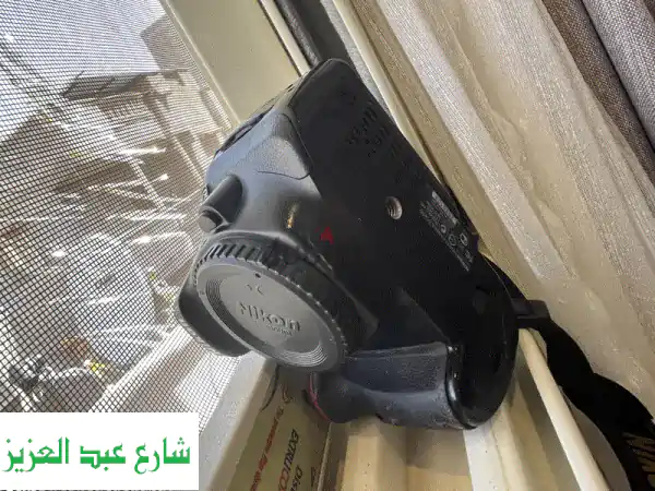 Nikon D5200 للبيع: كاميرا احترافية بحالة ممتازة | شاتر...