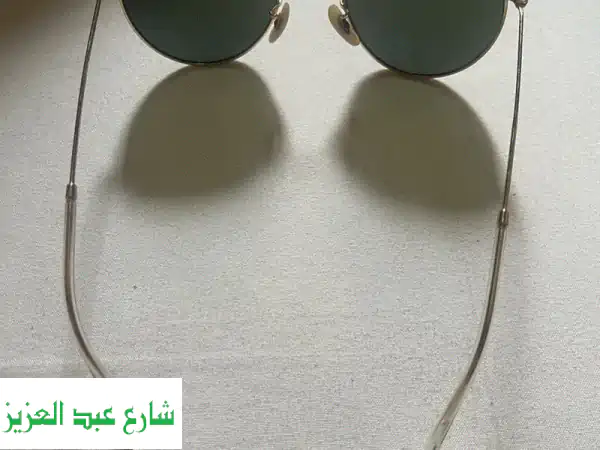 Ray-Ban Round Metal الأصلية: نظارات ذهبية خضراء أيقونية...