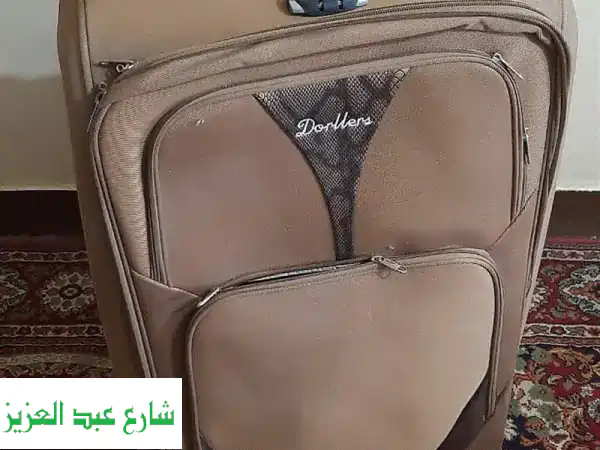 شنطة سفر تروللي ماركة ( Dorllers ) وارد الخارج. بعجلات...